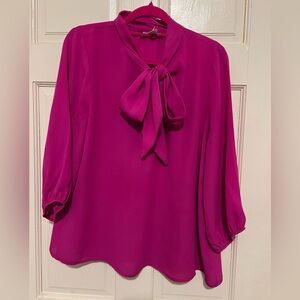 Women’s Fuchsia Tie Blouse in a size M.